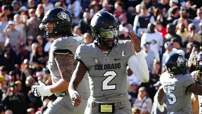 Nov 11, 2023; Boulder, Colorado, USA; Colorado Buffaloes quarterback Shedeur Sanders (2) celebrates after a touchdown against the Arizona Wildcats in the second quarter at Folsom Field. Mandatory Credit: Ron Chenoy-USA TODAY Sports