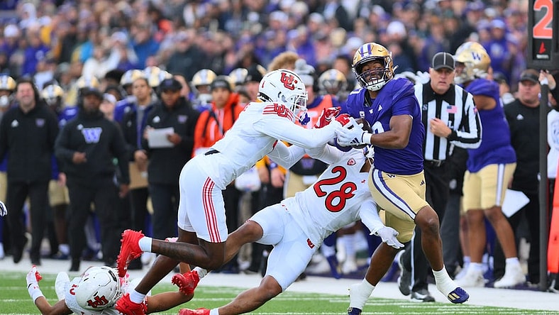 Nov 11, 2023; Seattle, Washington, USA; Washington Huskies running back Dillon Johnson (7) carries the ball after a catch against the Utah Utes during the first half at Alaska Airlines Field at Husky Stadium. Mandatory Credit: Steven Bisig-USA TODAY Sports