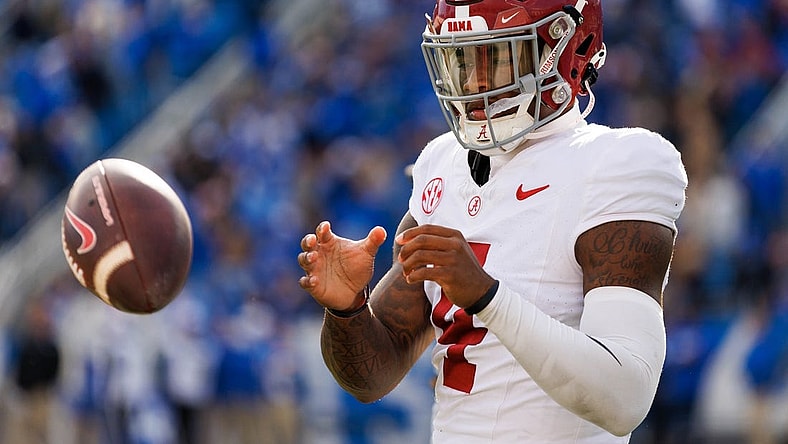 Nov 11, 2023; Lexington, Kentucky, USA; Alabama Crimson Tide quarterback Jalen Milroe (4) warms up during a timeout during the third quarter against the Kentucky Wildcats at Kroger Field. Mandatory Credit: Jordan Prather-USA TODAY Sports