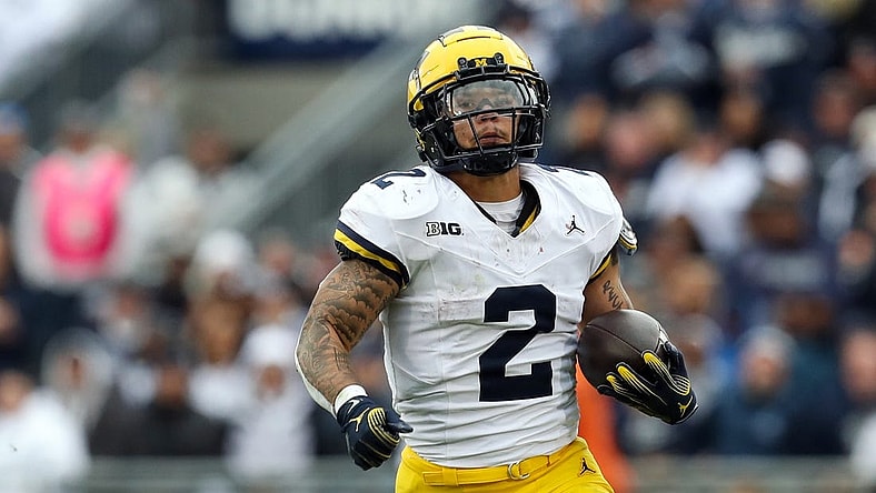 Nov 11, 2023; University Park, Pennsylvania, USA; Michigan Wolverines running back Blake Corum (2) runs the ball against the Penn State Nittany Lions during the second quarter at Beaver Stadium. Michigan won 24-15. Mandatory Credit: Matthew O'Haren-USA TODAY Sports