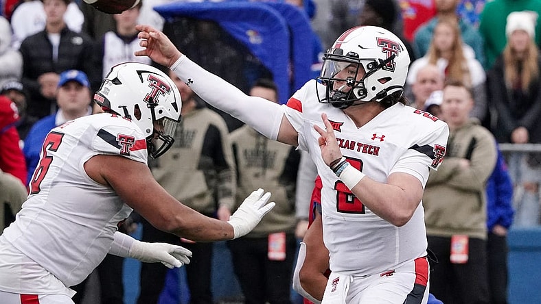 Nov 11, 2023; Lawrence, Kansas, USA; Texas Tech Red Raiders quarterback Behren Morton (2) throws a pass against the Kansas Jayhawks during the second half at David Booth Kansas Memorial Stadium. Mandatory Credit: Denny Medley-USA TODAY Sports