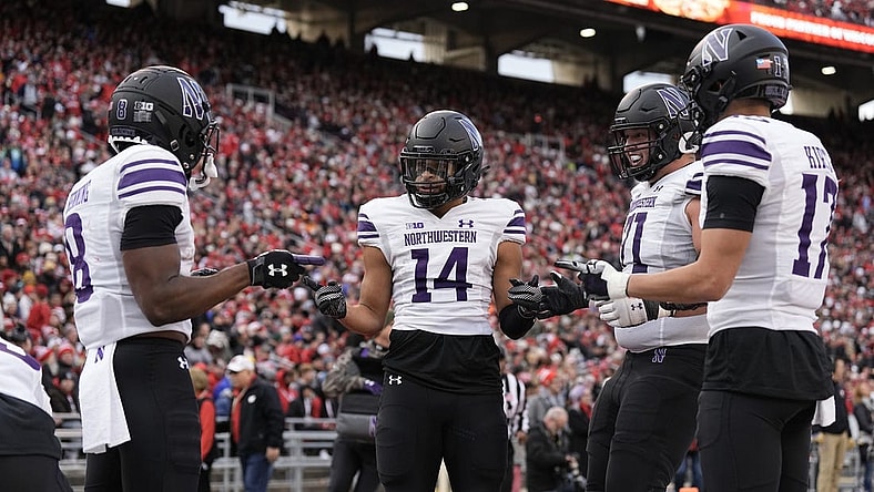 Nov 11, 2023; Madison, Wisconsin, USA;  Northwestern Wildcats wide receiver Cam Johnson (14) celebrates after scoring a touchdown during the second quarter against the Wisconsin Badgers at Camp Randall Stadium. Mandatory Credit: Jeff Hanisch-USA TODAY Sports