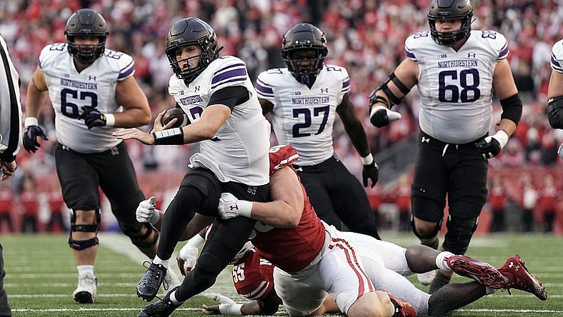 Nov 11, 2023; Madison, Wisconsin, USA;  Northwestern Wildcats quarterback Ben Bryant (2) rushes with the football during the second quarter against the Wisconsin Badgers at Camp Randall Stadium. Mandatory Credit: Jeff Hanisch-USA TODAY Sports