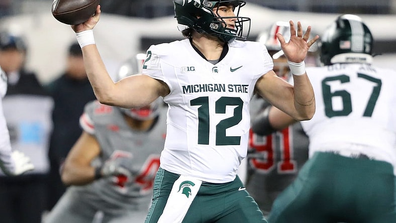 Nov 11, 2023; Columbus, Ohio, USA; Michigan State Spartans quarterback Katin Houser (12) drops back to throw during the first quarter against the Ohio State Buckeyes at Ohio Stadium. Mandatory Credit: Joseph Maiorana-USA TODAY Sports