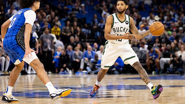 Nov 11, 2023; Orlando, Florida, USA; Milwaukee Bucks guard Cameron Payne (15) passes the ball past Orlando Magic guard Anthony Black (0) during the second half at Amway Center. Mandatory Credit: Matt Pendleton-USA TODAY Sports