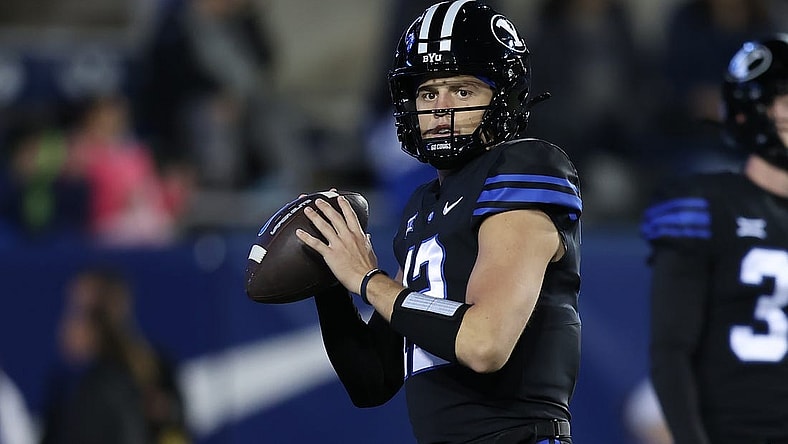 Nov 11, 2023; Provo, Utah, USA; Brigham Young Cougars quarterback Jake Retzlaff (12) warms up before the game against the Iowa State Cyclones at LaVell Edwards Stadium. Mandatory Credit: Rob Gray-USA TODAY Sports
