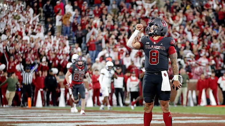 Oklahoma's Dillon Gabriel (8) reacts after scoring a touchdown in the second half of a college football game between the University of Oklahoma Sooners and the West Virginia Mountaineers at Gaylord Family-Oklahoma Memorial Stadium in Norman, Okla., Saturday, Nov., 11, 2023.