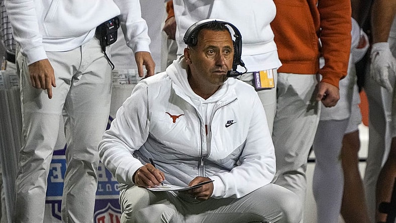 Nov 11, 2023; Fort Worth, Texas, USA; Texas Longhorns head coach Steve Sarkisian kneels on the sideline during the game against the TCU Horned Frogs at Amon G. Carter Stadium. Mandatory Credit: Aaron E. Martinez-USA TODAY Sports