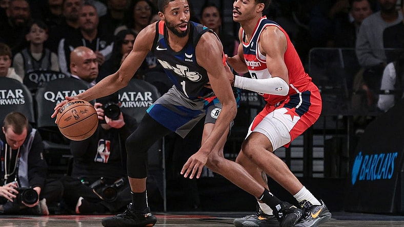 Nov 12, 2023; Brooklyn, New York, USA; Brooklyn Nets forward Mikal Bridges (1) dribbles against Washington Wizards guard Jordan Poole (13) during the second half at Barclays Center. Mandatory Credit: Vincent Carchietta-USA TODAY Sports