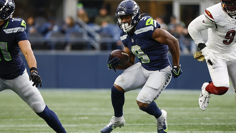 Nov 12, 2023; Seattle, Washington, USA; Seattle Seahawks running back Kenneth Walker III (9) rushes against the Washington Commanders during the second quarter at Lumen Field. Mandatory Credit: Joe Nicholson-USA TODAY Sports