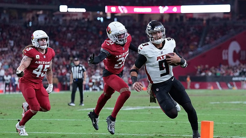 Nov 12, 2023; Glendale, Arizona, USA; Atlanta Falcons quarterback Desmond Ridder (9) runs for a touchdown against the Arizona Cardinals during the second half at State Farm Stadium. Mandatory Credit: Joe Camporeale-USA TODAY Sports