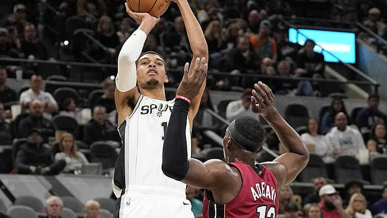 Nov 12, 2023; San Antonio, Texas, USA; San Antonio Spurs center Victor Wembanyama (1) shoots over Miami Heat center Bam Adebayo (13) during the first half at Frost Bank Center. Mandatory Credit: Scott Wachter-USA TODAY Sports
