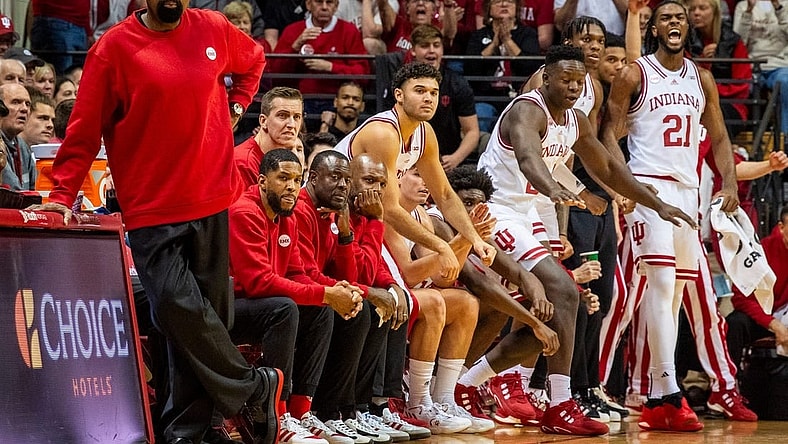 Indiana Head Coach Mike Woodson and the coaching staff wear red sweaters during the first half of the Indiana versus Army men's basketball game at Simon Skjodt Assembly Hall on Sunday, Nov. 12. 2023.