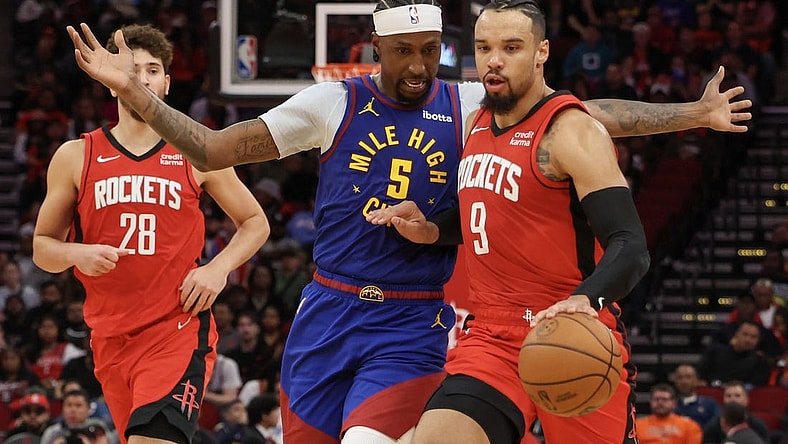 Nov 12, 2023; Houston, Texas, USA; Houston Rockets forward Dillon Brooks (9) dribbles against Denver Nuggets guard Kentavious Caldwell-Pope (5) in the second quarter at Toyota Center. Mandatory Credit: Thomas Shea-USA TODAY Sports