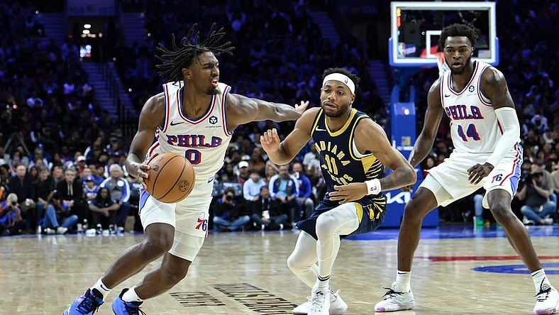 Nov 12, 2023; Philadelphia, Pennsylvania, USA; Philadelphia 76ers guard Tyrese Maxey (0) drives to the basket against Indiana Pacers forward Bruce Brown (11) during the fourth quarter at Wells Fargo Center. Mandatory Credit:  John Jones-USA TODAY Sports