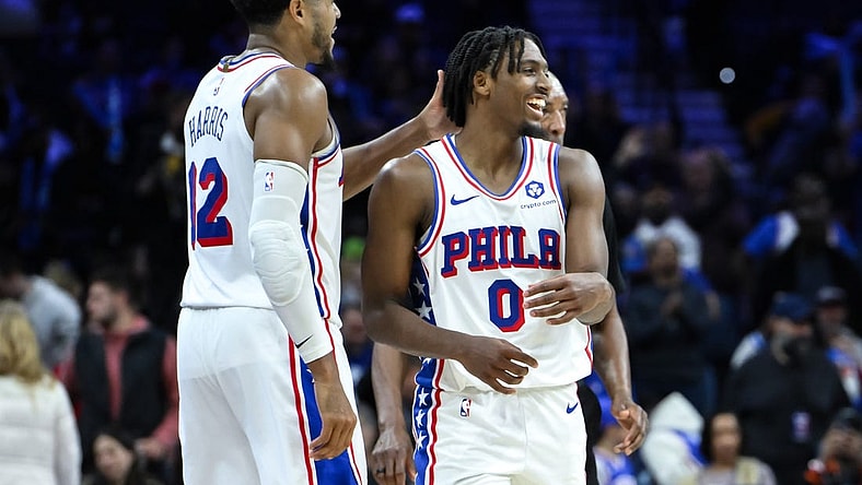 Nov 12, 2023; Philadelphia, Pennsylvania, USA; Philadelphia 76ers guard Tyrese Maxey (0) is greeted by Philadelphia 76ers forward Tobias Harris (12) after a 50 point performance against the Indiana Pacers at Wells Fargo Center. Mandatory Credit:  John Jones-USA TODAY Sports