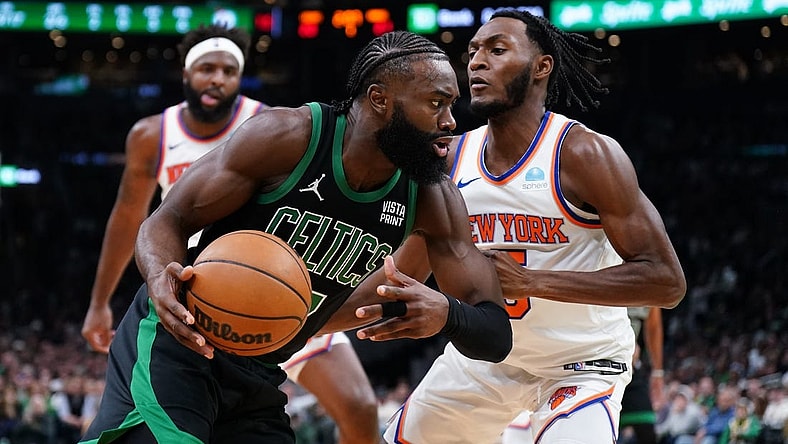 Nov 13, 2023; Boston, Massachusetts, USA; Boston Celtics guard Jaylen Brown (7) drives the ball against New York Knicks guard Immanuel Quickley (5) in the first quarter at TD Garden. Mandatory Credit: David Butler II-USA TODAY Sports
