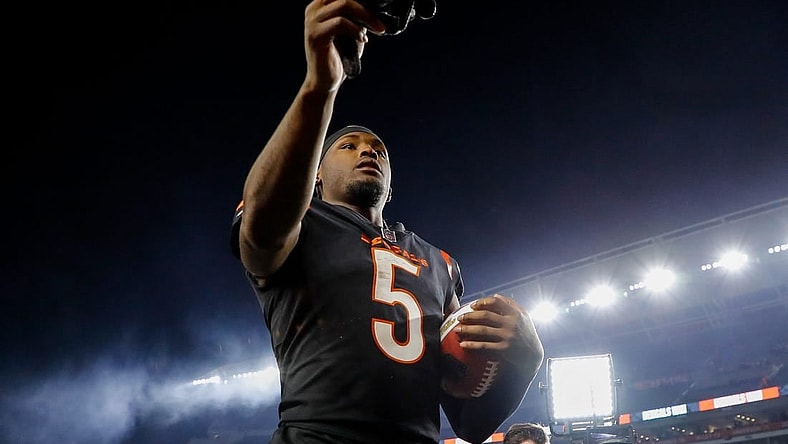 Nov 5, 2023; Cincinnati, Ohio, USA; Cincinnati Bengals wide receiver Tee Higgins (5) hands his gloves to fans after the victory over the Buffalo Bills at Paycor Stadium. Mandatory Credit: Katie Stratman-USA TODAY Sports