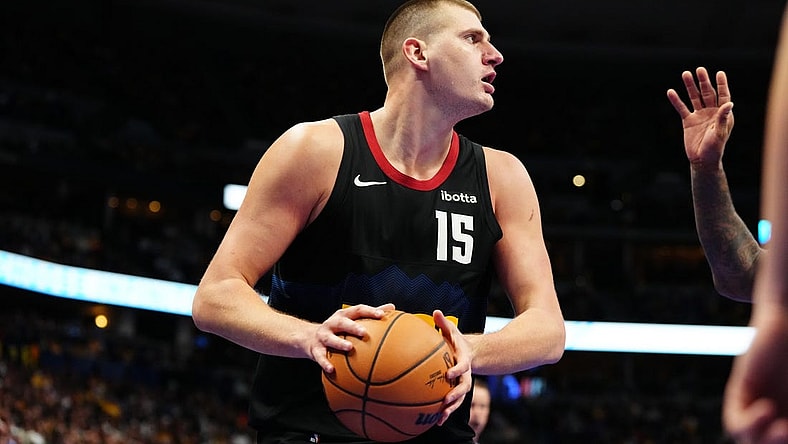 Nov 14, 2023; Denver, Colorado, USA; Denver Nuggets center Nikola Jokic (15) controls the ball in the second half against the LA Clippers at Ball Arena. Mandatory Credit: Ron Chenoy-USA TODAY Sports