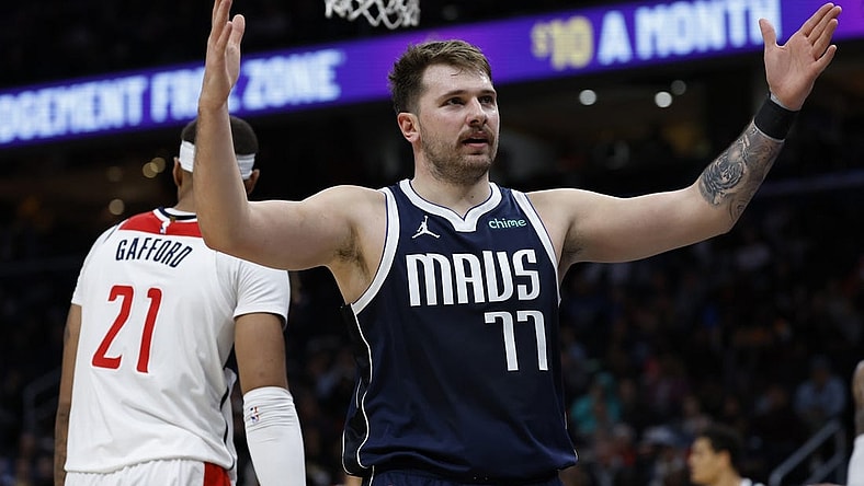 Nov 15, 2023; Washington, District of Columbia, USA; Dallas Mavericks guard Luka Doncic (77) gestures after scoring against the Washington Wizards in the second quarter at Capital One Arena. Mandatory Credit: Geoff Burke-USA TODAY Sports