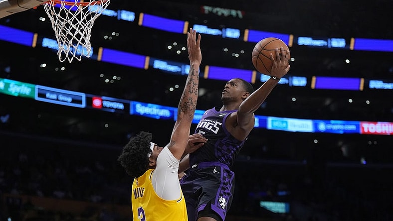 Nov 15, 2023; Los Angeles, California, USA; Sacramento Kings guard De'Aaron Fox (5) shoots the ball against Los Angeles Lakers forward Anthony Davis (3) in the first half at Crypto.com Arena. Mandatory Credit: Kirby Lee-USA TODAY Sports