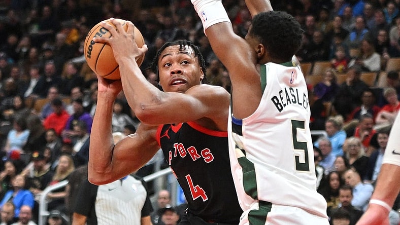 Nov 15, 2023; Toronto, Ontario, CAN;  Toronto Raptors forward Scottie Barnes (4) looks for a way past Milwaukee Bucks guard Malik Beasley (5) in the first half at Scotiabank Arena. Mandatory Credit: Dan Hamilton-USA TODAY Sports