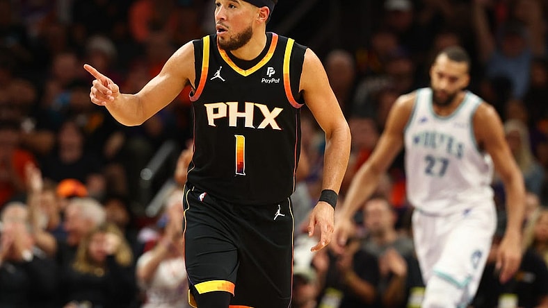 Nov 15, 2023; Phoenix, Arizona, USA; Phoenix Suns guard Devin Booker (1) reacts against the Minnesota Timberwolves in the second half at Footprint Center. Mandatory Credit: Mark J. Rebilas-USA TODAY Sports