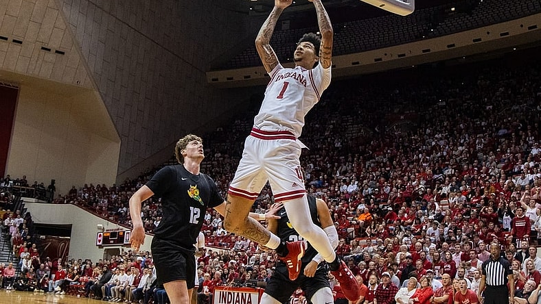 Nov 16, 2023; Bloomington, Indiana, USA; Indiana Hoosiers center Kel'el Ware (1) shoots the ball while Wright State Raiders center AJ Braun (12) defends in the first half at Simon Skjodt Assembly Hall. Mandatory Credit: Trevor Ruszkowski-USA TODAY Sports