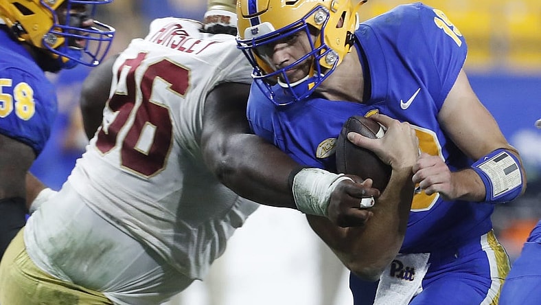 Nov 16, 2023; Pittsburgh, Pennsylvania, USA; Pittsburgh Panthers quarterback Nate Yarnell (19) carries the ball against Boston College Eagles defensive tackle Cam Horsley (96) during the second quarter at Acrisure Stadium. Mandatory Credit: Charles LeClaire-USA TODAY Sports