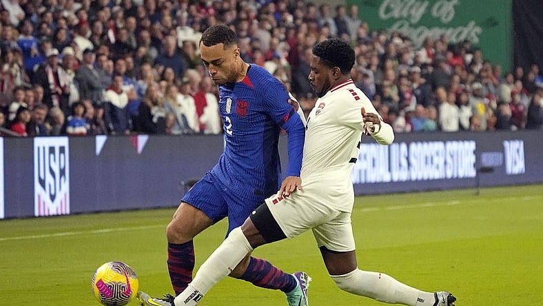 Nov 16, 2023; Austin, Texas, USA; U.S. Men's National team defender Sergino Dest (2) and Trinidad and Tobago defender Andre Raymond (6) battle for the ball during the first half in the Concacaf Quarterfinal at Q2 Stadium. Mandatory Credit: Scott Wachter-USA TODAY Sports