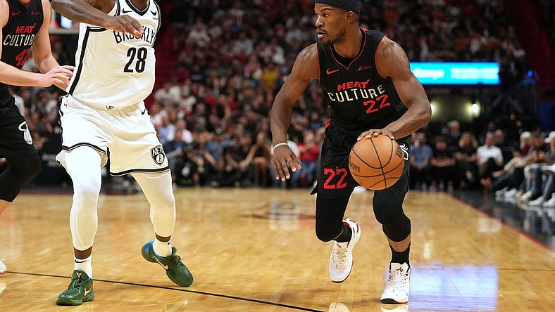 Nov 16, 2023; Miami, Florida, USA;  Miami Heat forward Jimmy Butler (22) drives to the basket as Brooklyn Nets forward Dorian Finney-Smith (28) defends in the first half at Kaseya Center. Mandatory Credit: Jim Rassol-USA TODAY Sports