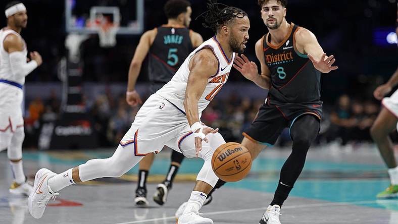 Nov 17, 2023; Washington, District of Columbia, USA; New York Knicks guard Jalen Brunson (11) drives to the basket as Washington Wizards forward Deni Avdija (8) defends in the first quarter at Capital One Arena. Mandatory Credit: Geoff Burke-USA TODAY Sports