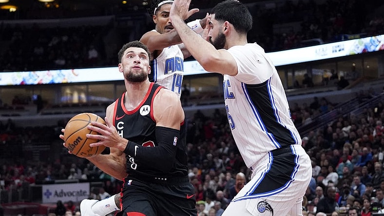 Nov 17, 2023; Chicago, Illinois, USA; Orlando Magic guard Gary Harris (14) defends Chicago Bulls guard Zach LaVine (8) during the first half at United Center. Mandatory Credit: David Banks-USA TODAY Sports