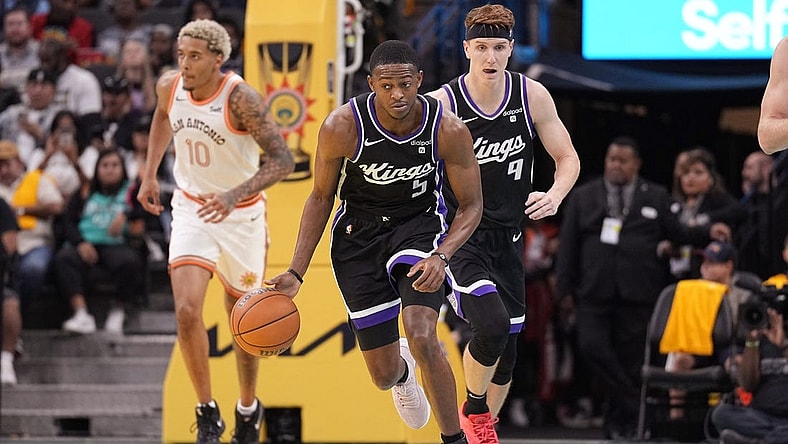 Nov 17, 2023; San Antonio, Texas, USA; Sacramento Kings guard De'Aaron Fox (5) dribbles up court  during the second half against the San Antonio Spurs at Frost Bank Center. Mandatory Credit: Scott Wachter-USA TODAY Sports