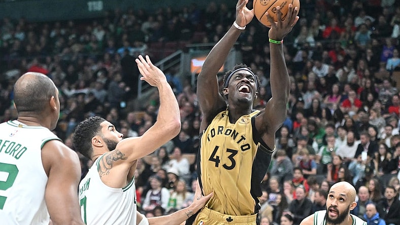 Nov 17, 2023; Toronto, Ontario, CAN;   Toronto Raptors forward Pascal Siakam (43) shoots the ball over Boston Celtics forward Jayson Tatum (0) in the second half at Scotiabank Arena. Mandatory Credit: Dan Hamilton-USA TODAY Sports