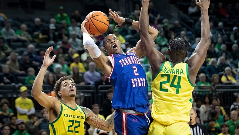 Oregon center Mahamadou Diawara fouls Tennessee State guard Christian Brown as the Oregon Ducks host Tennessee State Friday, Nov. 17, 2023, at Matthew Knight Arena in Eugene, Ore.