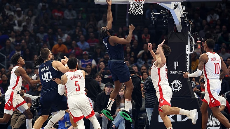 Nov 17, 2023; Los Angeles, California, USA;  L.A. Clippers guard James Harden (1) drives to the basket during the first quarter against the Houston Rockets at Crypto.com Arena. Mandatory Credit: Kiyoshi Mio-USA TODAY Sports