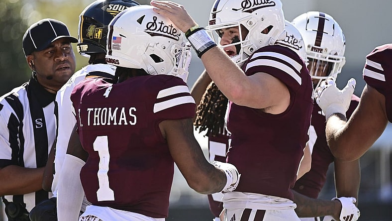 Nov 18, 2023; Starkville, Mississippi, USA; Mississippi State Bulldogs quarterback Will Rogers (2) reacts with  wide receiver Zavion Thomas (1) after a touchdown against the Southern Miss Golden Eagles at Davis Wade Stadium at Scott Field. Mandatory Credit: Matt Bush-USA TODAY Sports