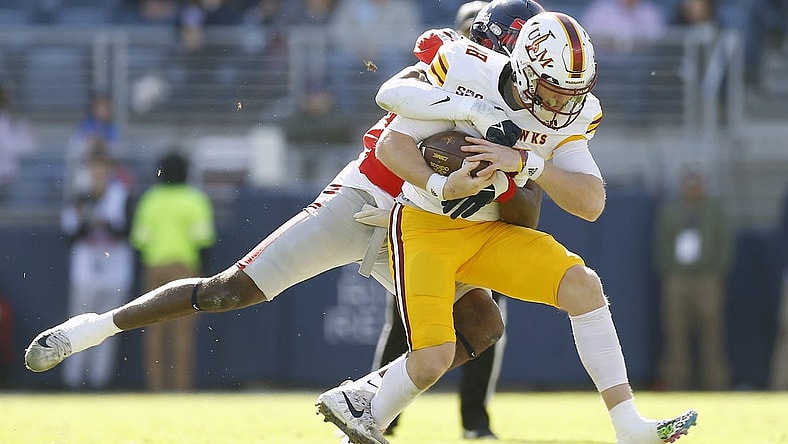 Nov 18, 2023; Oxford, Mississippi, USA; Louisiana Monroe Warhawks quarterback Jiya Wright (18) runs the ball as Mississippi Rebels defensive back Ladarius Tennison (13) makes the tackle during the first half at Vaught-Hemingway Stadium. Mandatory Credit: Petre Thomas-USA TODAY Sports