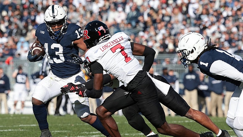 Nov 18, 2023; University Park, Pennsylvania, USA; Penn State Nittany Lions running back Kaytron Allen (13) carries the ball as Rutgers Scarlet Knights defensive back Robert Longerbeam (7) pursues during the first half at Beaver Stadium. Mandatory Credit: Vincent Carchietta-USA TODAY Sports