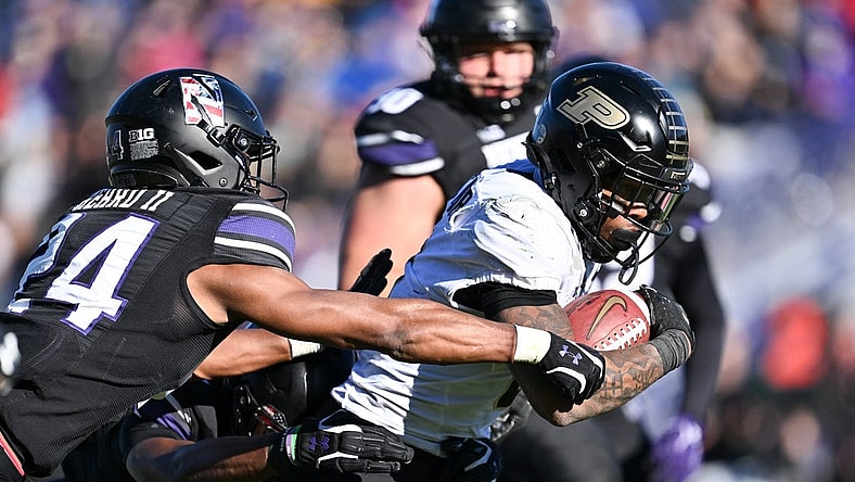 Nov 18, 2023; Evanston, Illinois, USA;  Purdue Boilermakers running back Tyrone Tracy Jr. (3) breaks a tackle by Northwestern Wildcats defensive back Rod Heard II (24) for a touchdown run in the third quarter at Ryan Field. Mandatory Credit: Jamie Sabau-USA TODAY Sports