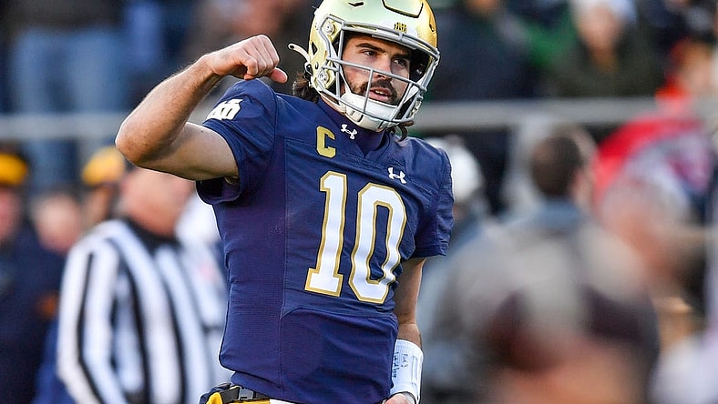 Nov 18, 2023; South Bend, Indiana, USA; Notre Dame Fighting Irish quarterback Sam Hartman (10) celebrates after throwing a touchdown pass in the second quarter against the Wake Forest Demon Deacons at Notre Dame Stadium. Mandatory Credit: Matt Cashore-USA TODAY Sports
