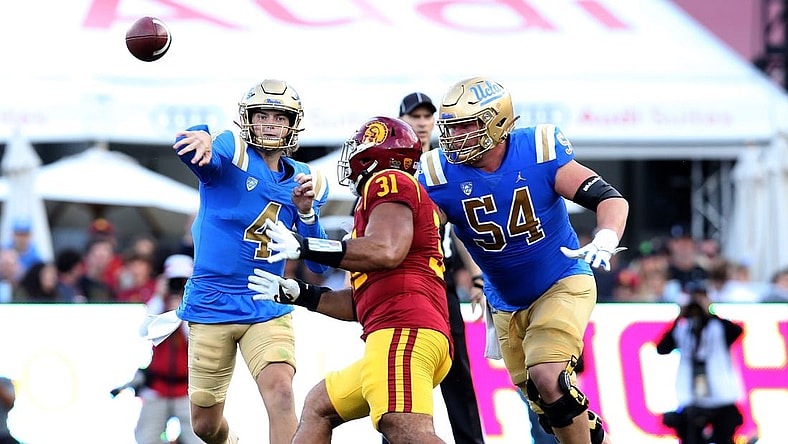 Nov 18, 2023; Los Angeles, California, USA; UCLA Bruins quarterback Ethan Garbers (4) throws during the second quarter against the USC Trojans at United Airlines Field at Los Angeles Memorial Coliseum. Mandatory Credit: Jason Parkhurst-USA TODAY Sports