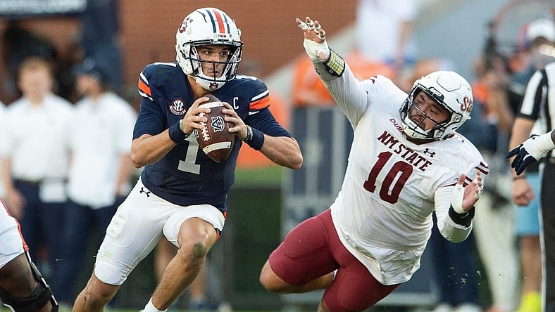 Auburn Tigers quarterback Payton Thorne (1) scrambles up the middle as Auburn Tigers take on New Mexico State Aggies at Jordan-Hare Stadium in Auburn, Ala., on Saturday, Nov. 18, 2023. New Mexico State Aggies leads Auburn Tigers 10-7 at halftime.