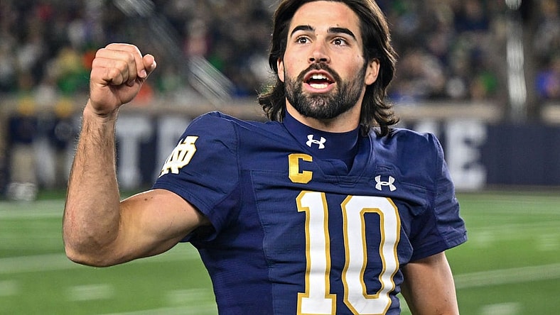Nov 18, 2023; South Bend, Indiana, USA; Notre Dame Fighting Irish quarterback Sam Hartman (10) exhorts the crowd in the fourth quarter against the Wake Forest Demon Deacons at Notre Dame Stadium. Mandatory Credit: Matt Cashore-USA TODAY Sports