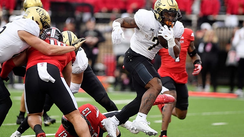 UCF's running back RJ Harvey (7) scores a touchdown against Texas Tech, Saturday, Nov. 18, 2023, at Jones AT&T Stadium.