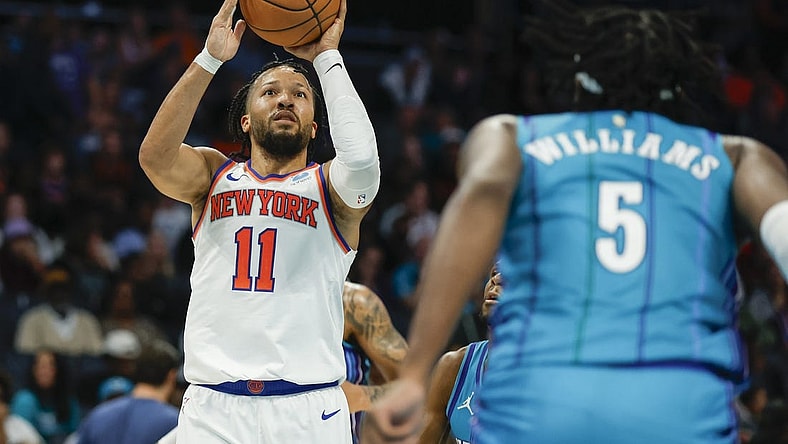 Nov 18, 2023; Charlotte, North Carolina, USA; New York Knicks guard Jalen Brunson (11) shoots the ball over Charlotte Hornets center Mark Williams (5) during the second half at Spectrum Center. Mandatory Credit: Nell Redmond-USA TODAY Sports