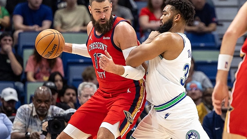 Nov 18, 2023; New Orleans, Louisiana, USA; New Orleans Pelicans center Jonas Valanciunas (17) fights for position against Minnesota Timberwolves center Karl-Anthony Towns (32) during the first half at the Smoothie King Center. Mandatory Credit: Stephen Lew-USA TODAY Sports