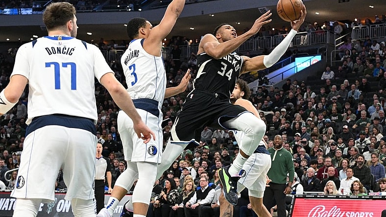 Nov 18, 2023; Milwaukee, Wisconsin, USA; Milwaukee Bucks forward Giannis Antetokounmpo (34) drives to the basket against Dallas Mavericks forward Grant Williams (3) in the first half at Fiserv Forum. Mandatory Credit: Michael McLoone-USA TODAY Sports