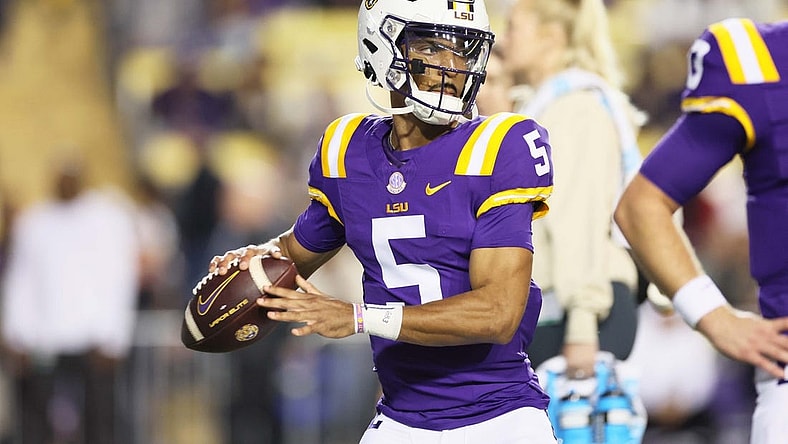 Nov 18, 2023; Baton Rouge, Louisiana, USA; Heisman Trophy candidate LSU Tigers quarterback Jayden Daniels (5) warms up before their game against the Georgia State Panthers at Tiger Stadium. Mandatory Credit: Matthew Dobbins-USA TODAY Sports